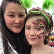 Image of Christina Kay Plumb with child and imaginative facepaint