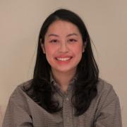 Profile photo of a Hmong woman with medium length dark hair and button up shirt