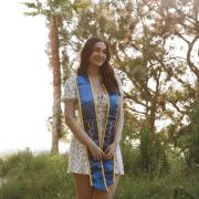 female with graduation sash